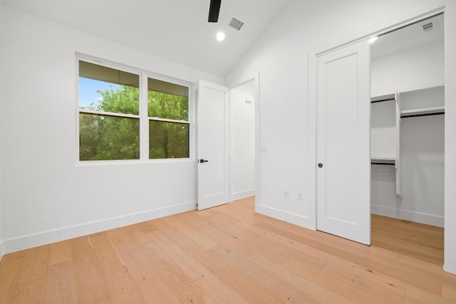 7706 Watson St Unit 2, Austin, TX 78757 - unfurnished bedroom featuring vaulted ceiling, light wood-type flooring, and recessed lighting