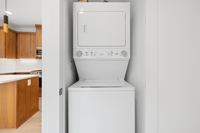 7706 Watson St Unit 2, Austin, TX 78757 - laundry room featuring stacked washer / dryer