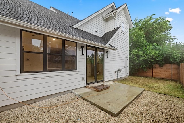 7706 Watson St Unit 2, Austin, TX 78757 - rear view of property with roof with shingles and a patio area