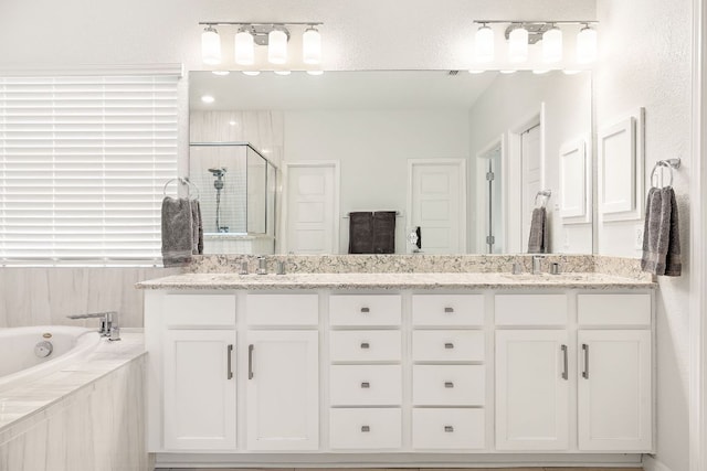 16713 Elsinore Ln, Pflugerville, TX 78660 - full bath with a stall shower, double vanity, and a bath