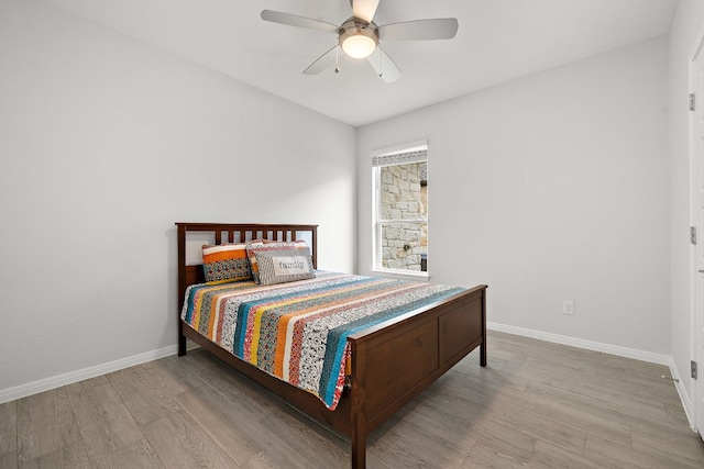 16713 Elsinore Ln, Pflugerville, TX 78660 - bedroom featuring wood finished floors and a ceiling fan