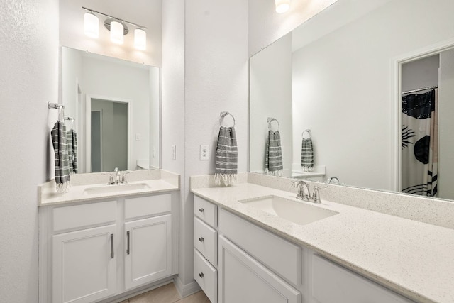 16713 Elsinore Ln, Pflugerville, TX 78660 - full bathroom with two vanities