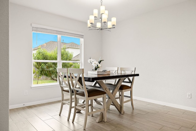 16713 Elsinore Ln, Pflugerville, TX 78660 - dining space featuring a chandelier, plenty of natural light, and light wood finished floors