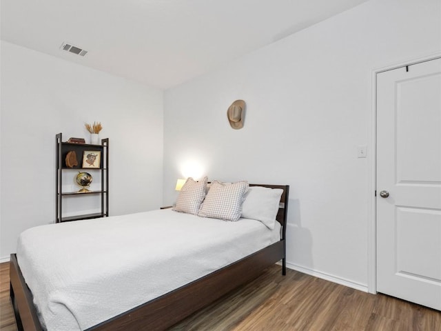 308 Sunfish Ln, Bastrop, TX 78602 - bedroom featuring wood finished floors and baseboards