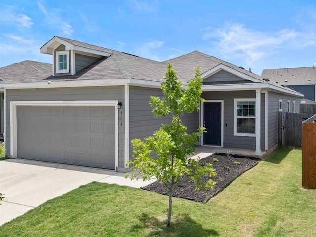 308 Sunfish Ln, Bastrop, TX 78602 - ranch-style house featuring an attached garage and driveway