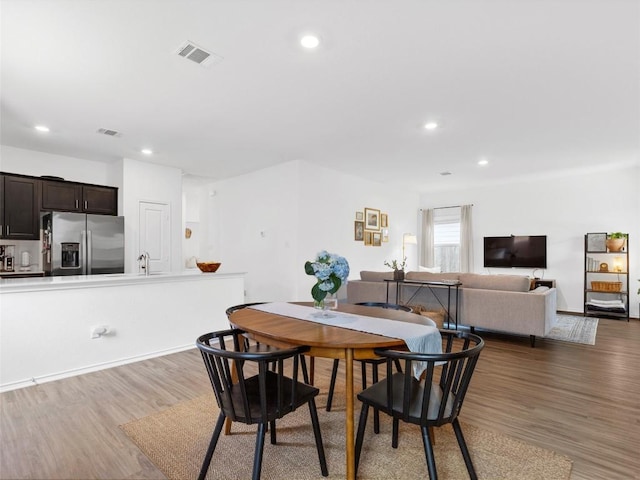 308 Sunfish Ln, Bastrop, TX 78602 - dining area with wood finished floors and recessed lighting