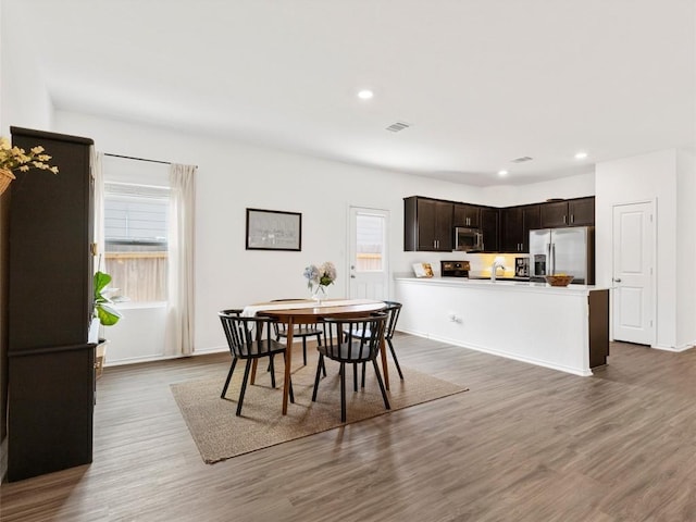 308 Sunfish Ln, Bastrop, TX 78602 - dining space with wood finished floors and recessed lighting