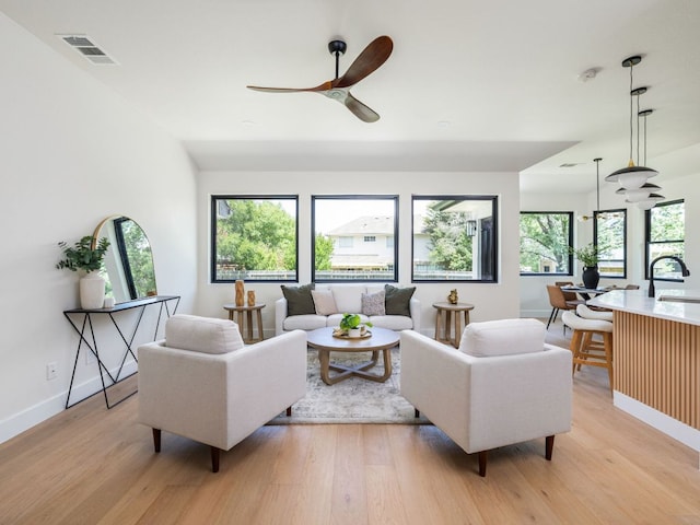 6000 Roxbury Ln, Austin, TX 78739 - living area featuring ceiling fan, light wood-style floors, and an office area