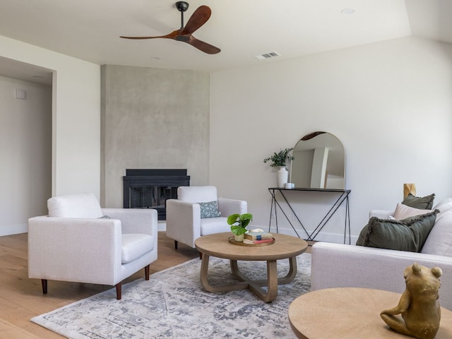 6000 Roxbury Ln, Austin, TX 78739 - living area with ceiling fan, wood finished floors, and a glass covered fireplace
