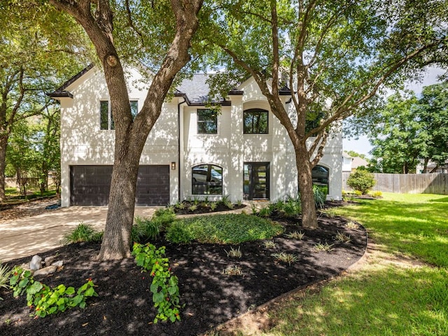 6000 Roxbury Ln, Austin, TX 78739 - french country inspired facade with driveway, an attached garage, and roof with shingles