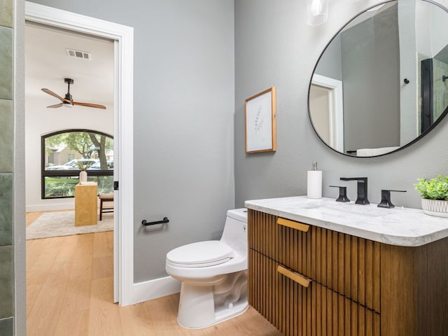 6000 Roxbury Ln, Austin, TX 78739 - bathroom with vanity, wood finished floors, and ceiling fan