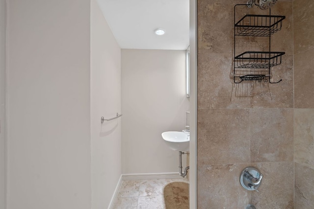 1212 Guadalupe St Unit 805, Austin, TX 78701 - bathroom featuring baseboards and a sink