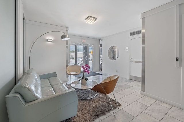 1212 Guadalupe St Unit 805, Austin, TX 78701 - living area with crown molding and light marble finish floors
