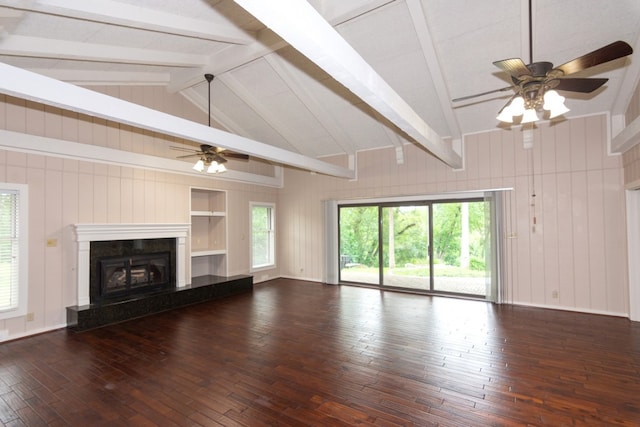 1404 Pearl Cv, Round Rock, TX 78681 - unfurnished living room featuring a ceiling fan, hardwood / wood-style floors, healthy amount of natural light, and wood walls