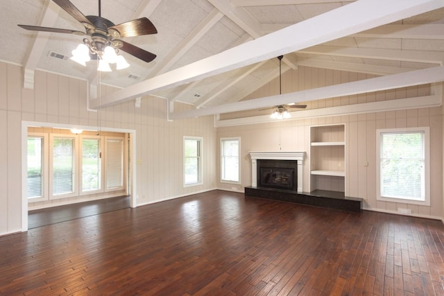 1404 Pearl Cv, Round Rock, TX 78681 - unfurnished living room featuring a ceiling fan, dark wood-style floors, and a fireplace with raised hearth