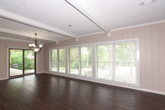 1404 Pearl Cv, Round Rock, TX 78681 - empty room featuring beam ceiling, a chandelier, and dark wood-style flooring