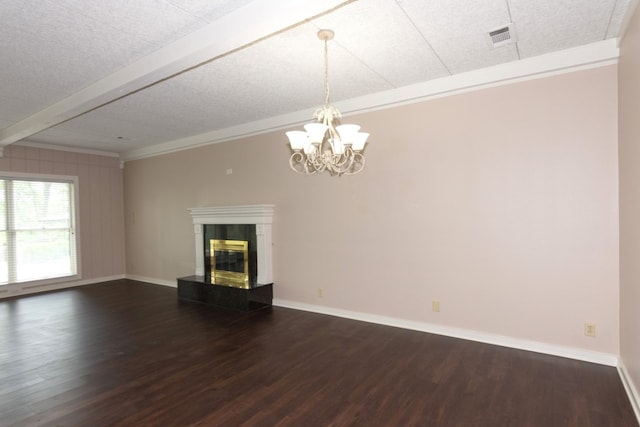 1404 Pearl Cv, Round Rock, TX 78681 - unfurnished living room featuring dark wood finished floors, crown molding, a chandelier, a tile fireplace, and beam ceiling