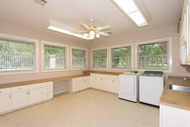 1404 Pearl Cv, Round Rock, TX 78681 - washroom featuring washer and dryer, cabinet space, plenty of natural light, and a ceiling fan