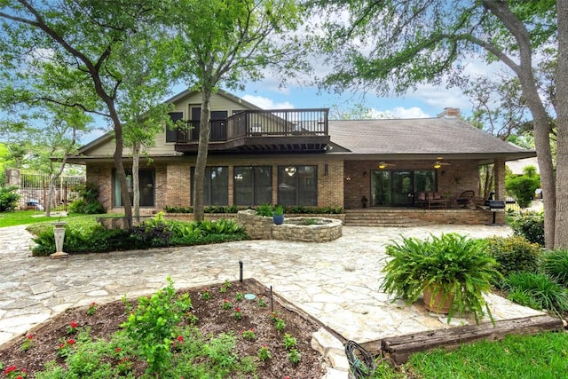 1404 Pearl Cv, Round Rock, TX 78681 - back of house featuring brick siding, a patio, and a balcony