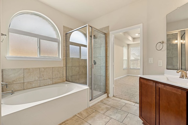 605 Joppa Rd, Leander, TX 78641 - bathroom with a garden tub, a stall shower, vanity, and tile patterned flooring