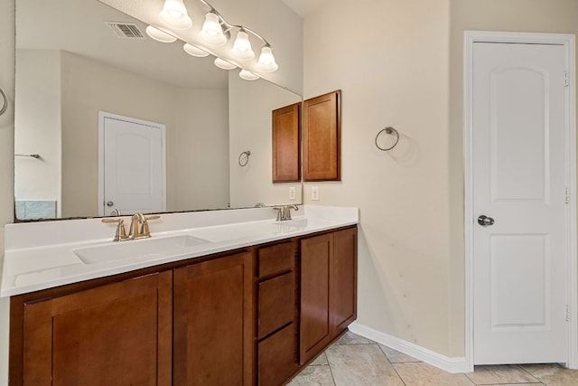 605 Joppa Rd, Leander, TX 78641 - bathroom with double vanity and tile patterned floors