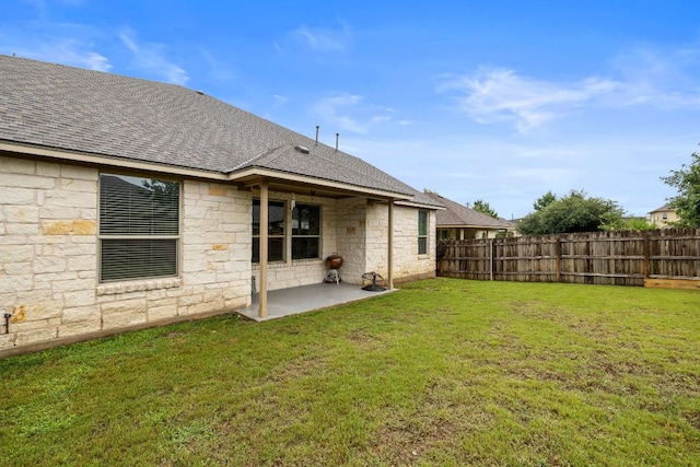 605 Joppa Rd, Leander, TX 78641 - back of property featuring stone siding, a patio, and roof with shingles