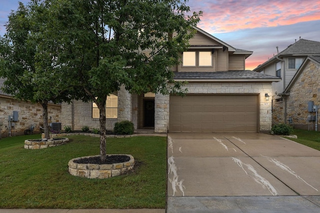 605 Joppa Rd, Leander, TX 78641 - view of front of home featuring stone siding, driveway, a lawn, an attached garage, and roof with shingles