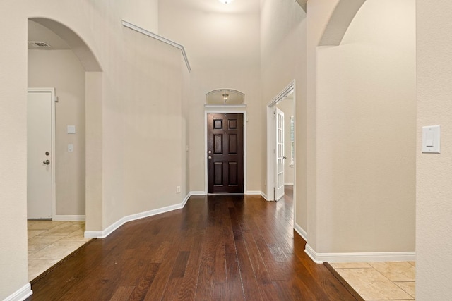 605 Joppa Rd, Leander, TX 78641 - foyer featuring hardwood / wood-style flooring, arched walkways, and a towering ceiling