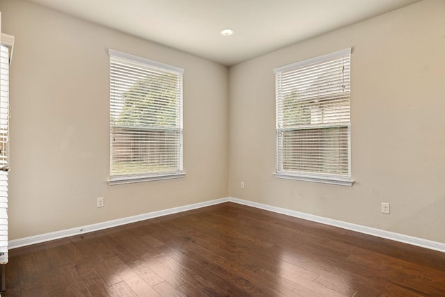 605 Joppa Rd, Leander, TX 78641 - unfurnished room with healthy amount of natural light and hardwood / wood-style floors
