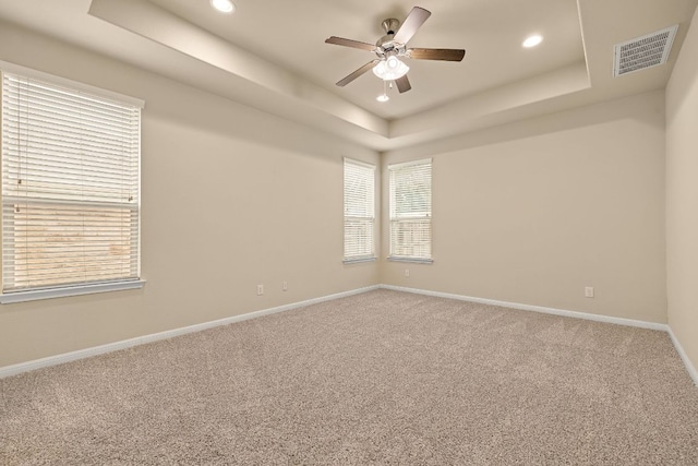 605 Joppa Rd, Leander, TX 78641 - unfurnished room with a tray ceiling, ceiling fan, recessed lighting, and carpet