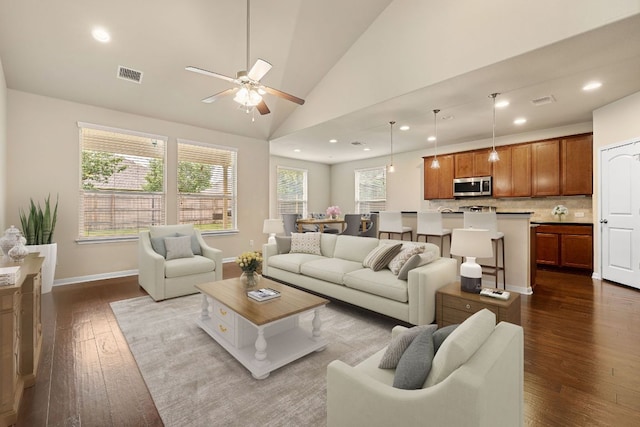 605 Joppa Rd, Leander, TX 78641 - living area featuring dark wood-style floors, lofted ceiling, ceiling fan, and recessed lighting