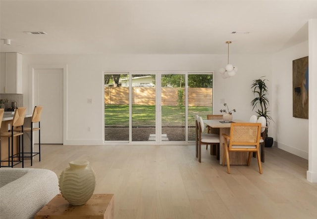 1206 Cloverleaf Dr, Austin, TX 78723 - dining room featuring light wood-type flooring