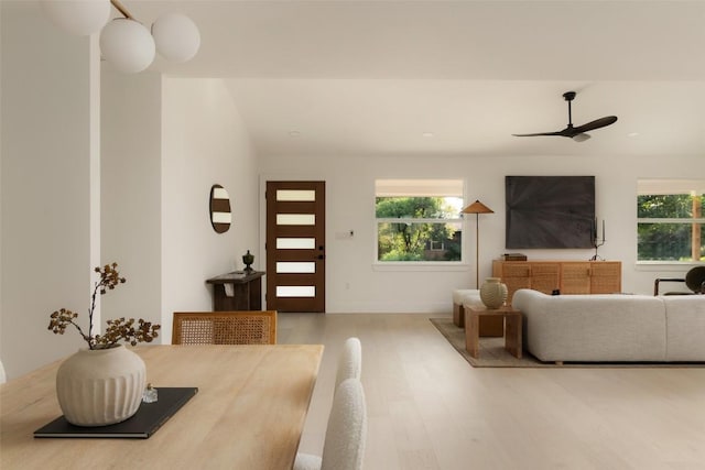 1206 Cloverleaf Dr, Austin, TX 78723 - living room with wood finished floors, a ceiling fan, and lofted ceiling
