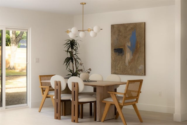 1206 Cloverleaf Dr, Austin, TX 78723 - dining area featuring a chandelier and baseboards