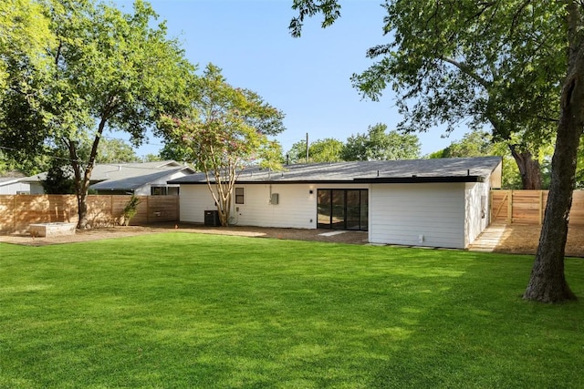 1206 Cloverleaf Dr, Austin, TX 78723 - rear view of house featuring a fenced backyard
