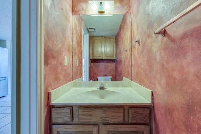 13102 Amarillo Ave, Austin, TX 78729 - bathroom with vanity and a textured ceiling