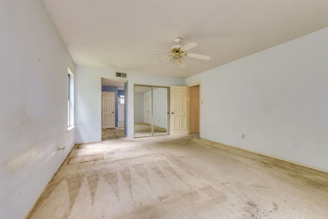 13102 Amarillo Ave, Austin, TX 78729 - unfurnished bedroom featuring carpet floors and a ceiling fan