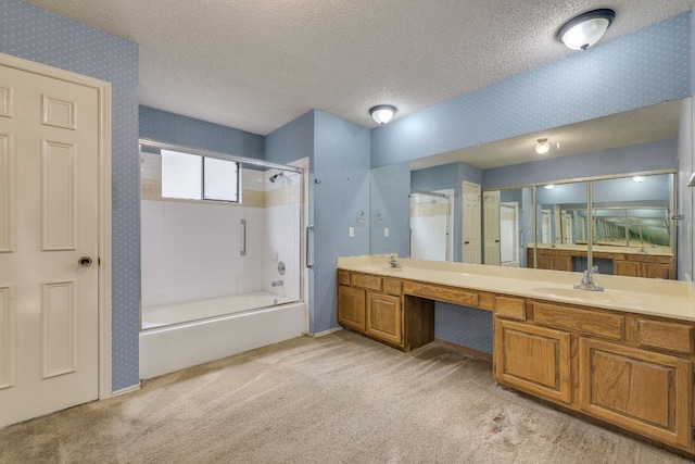 13102 Amarillo Ave, Austin, TX 78729 - bathroom with wallpapered walls, shower / bath combination, double vanity, and a textured ceiling