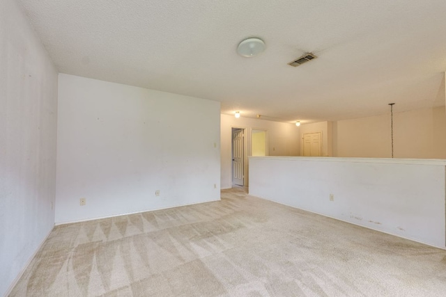 13102 Amarillo Ave, Austin, TX 78729 - unfurnished room featuring light carpet