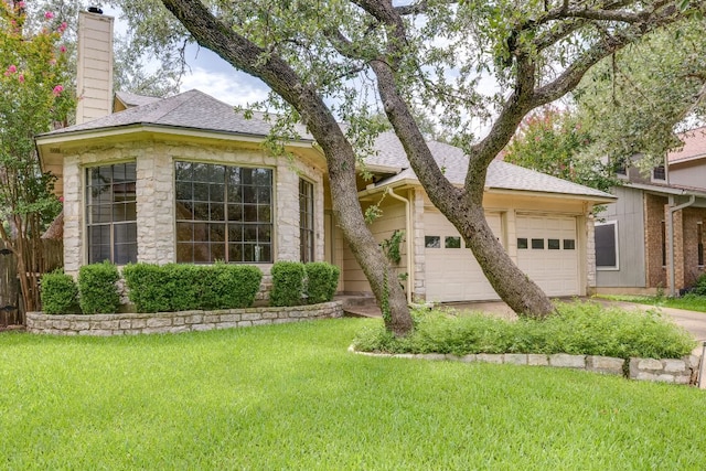 13102 Amarillo Ave, Austin, TX 78729 - view of front of home with a chimney, a shingled roof, a garage, concrete driveway, and stone siding