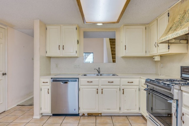 13102 Amarillo Ave, Austin, TX 78729 - kitchen with stainless steel dishwasher, black gas range, custom range hood, and light countertops