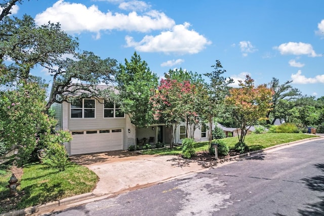 3104 Mistyglen Cir, Austin, TX 78746 - view of front of home with concrete driveway and a garage