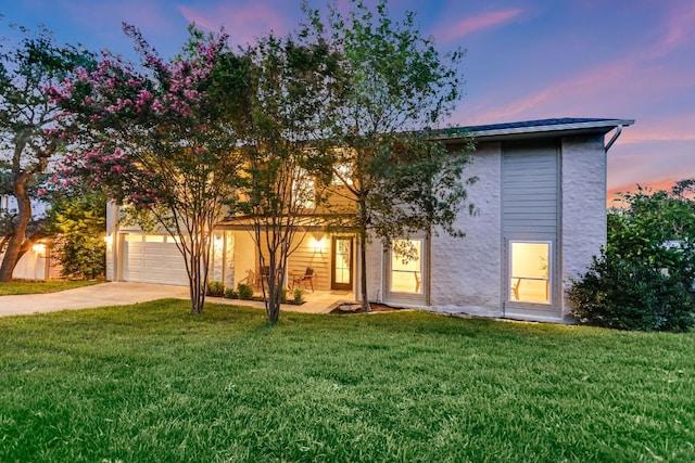 3104 Mistyglen Cir, Austin, TX 78746 - view of front of house featuring driveway, a garage, a front lawn, and stucco siding