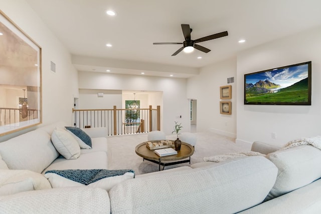 3104 Mistyglen Cir, Austin, TX 78746 - carpeted living area featuring a ceiling fan and recessed lighting