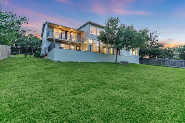 3104 Mistyglen Cir, Austin, TX 78746 - rear view of house with a balcony and a fenced backyard