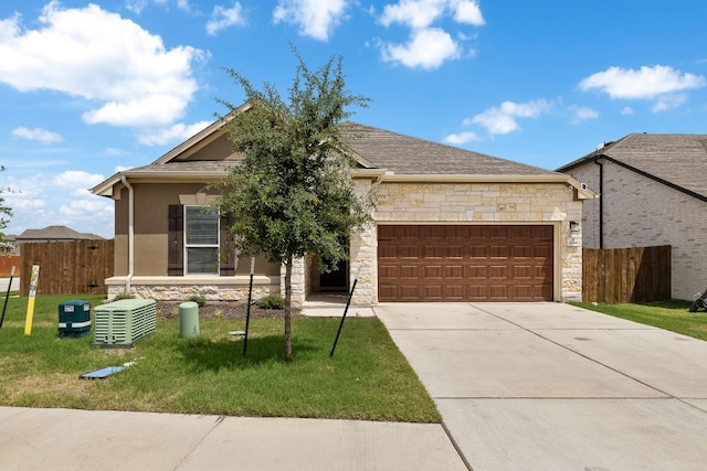 4669 Padula Dr, Round Rock, TX 78665 - view of front of property with stone siding, an attached garage, and concrete driveway