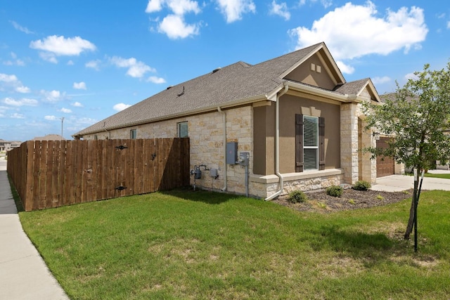 4669 Padula Dr, Round Rock, TX 78665 - view of property exterior featuring stone siding, a shingled roof, an attached garage, concrete driveway, and stucco siding