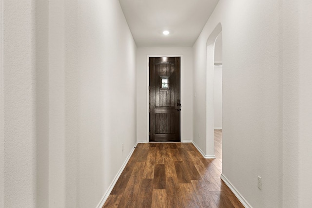 4669 Padula Dr, Round Rock, TX 78665 - doorway to outside featuring dark wood finished floors, arched walkways, and recessed lighting