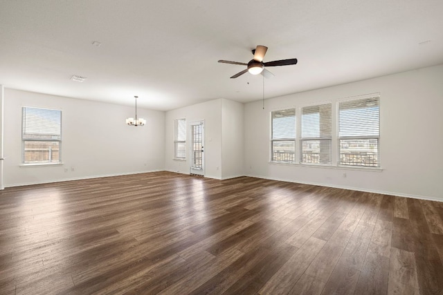 4669 Padula Dr, Round Rock, TX 78665 - unfurnished living room featuring a chandelier, ceiling fan, and dark wood-style flooring
