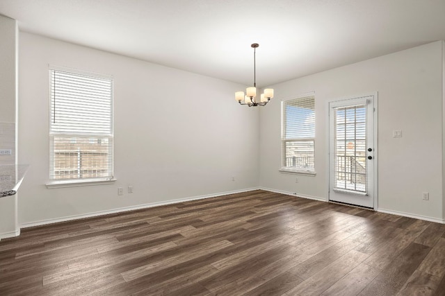 4669 Padula Dr, Round Rock, TX 78665 - unfurnished room with a chandelier, plenty of natural light, and dark wood-style floors